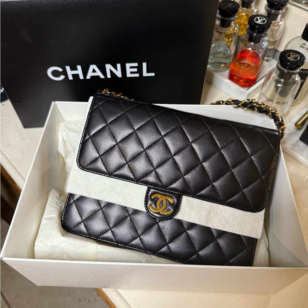 CHANEL Black Quilted Shoulder Bag with Gold Details